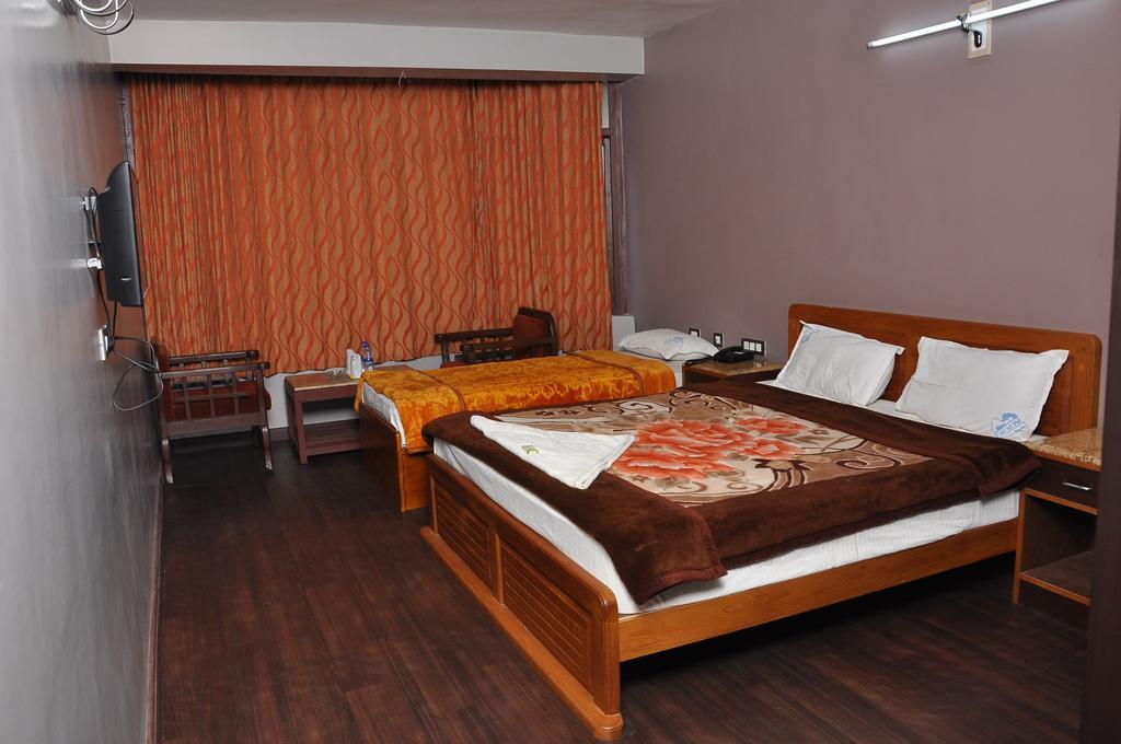 كوديكانال Grand Paradise Inn الغرفة الصورة