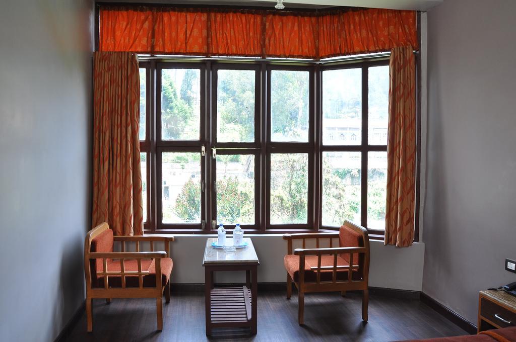 كوديكانال Grand Paradise Inn الغرفة الصورة